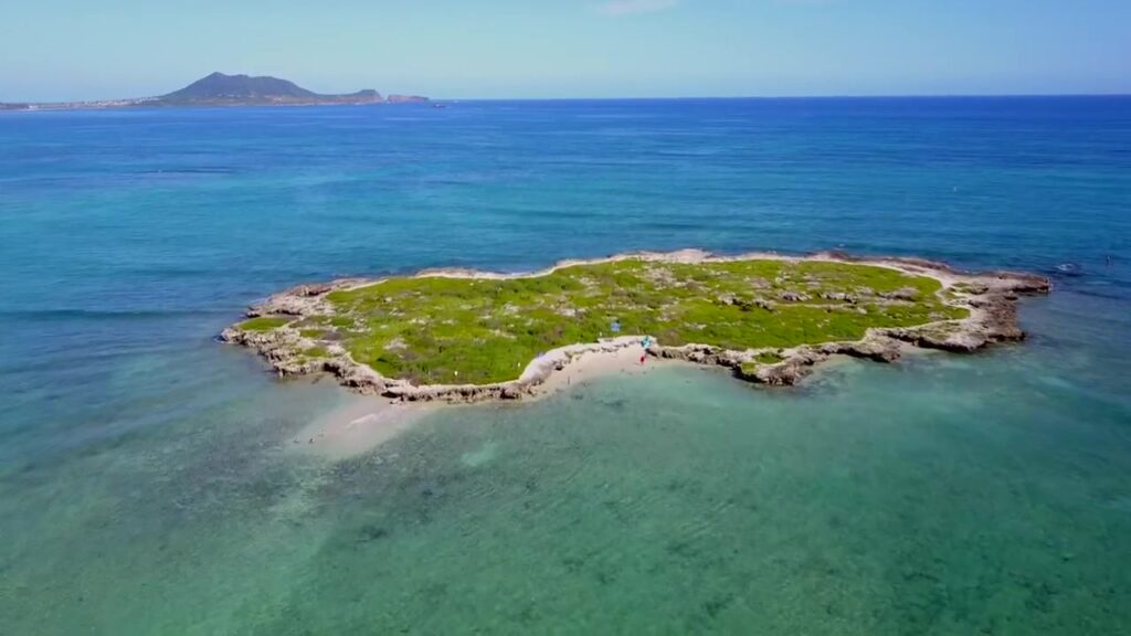 Aerial view of Popoiʻa, known as Flat Island, and its low rocky shoreline off Kailua Beach
