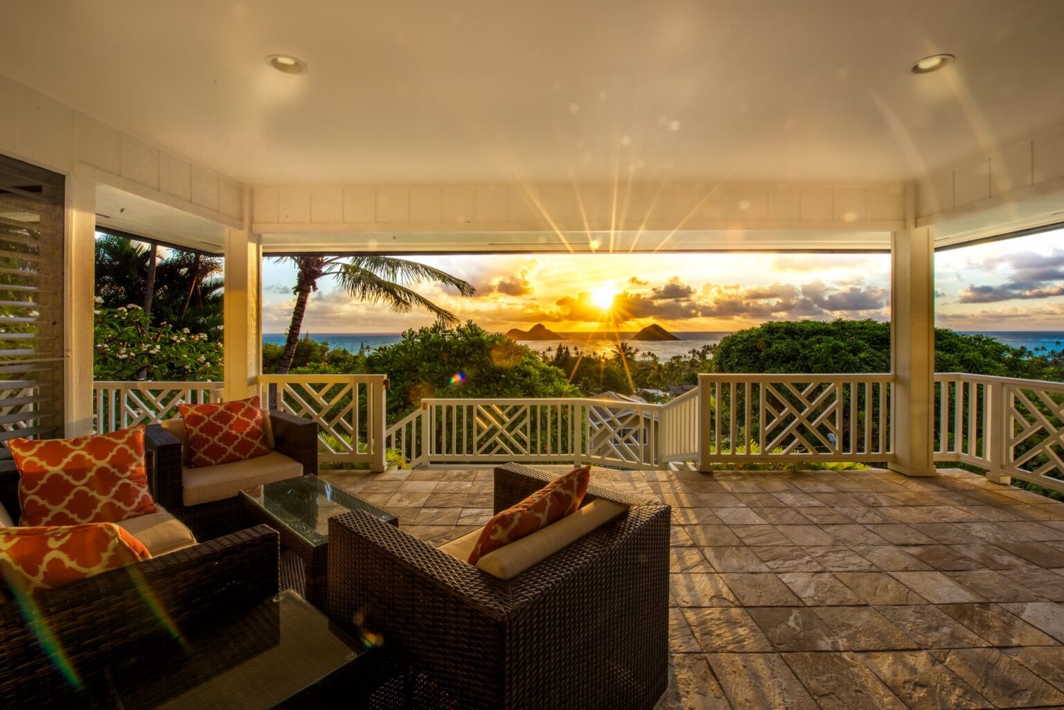 Sunset over the Mokulua Islands from the covered lanai at Kehaulani Ridge