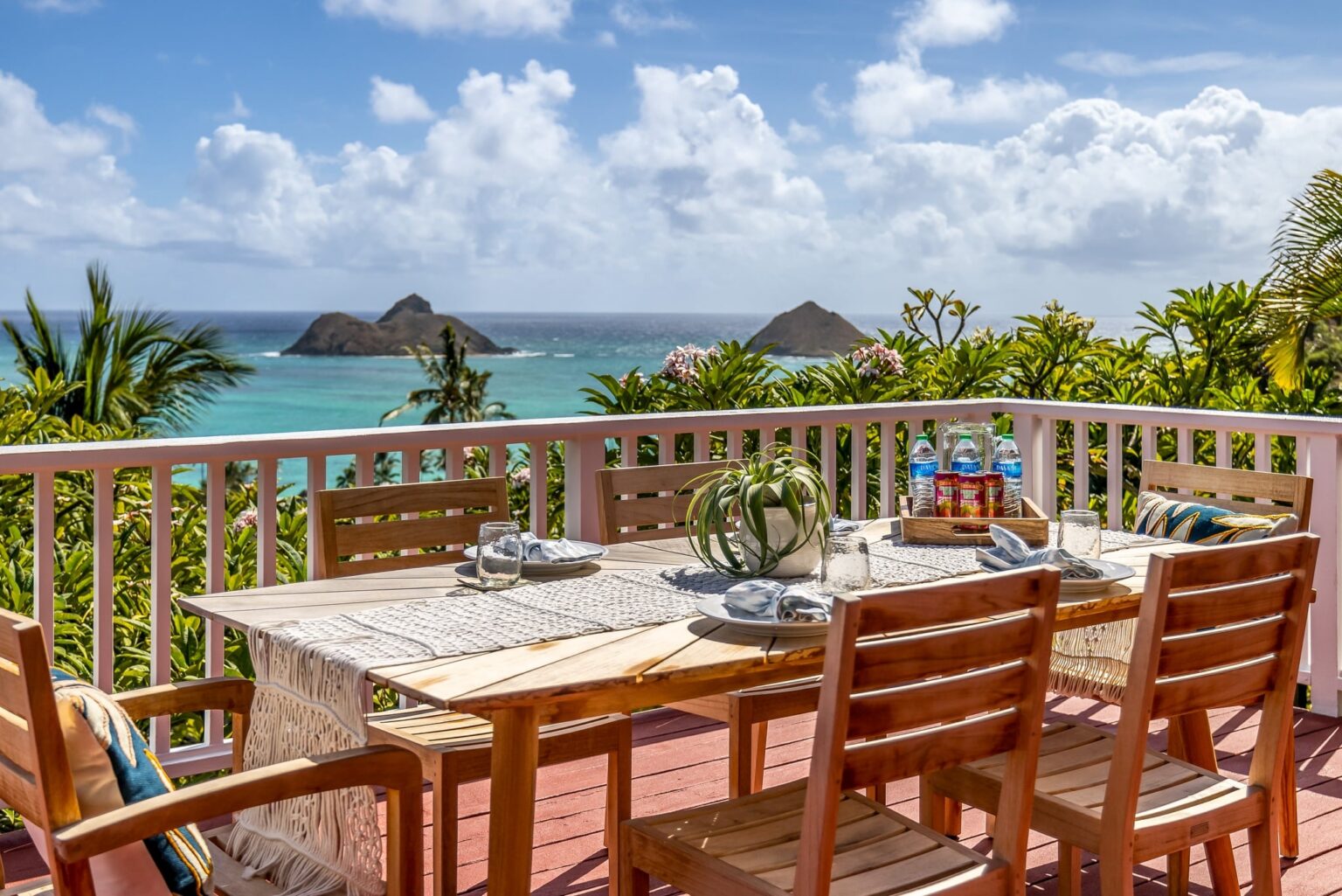 Lanai dining table looking out to the Mokulua Islands at Koohoo Place
