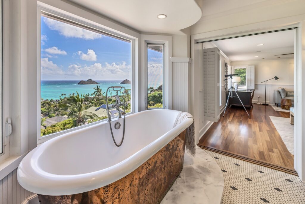 Copper-wrapped soaking tub facing the Mokes at Koohoo Place