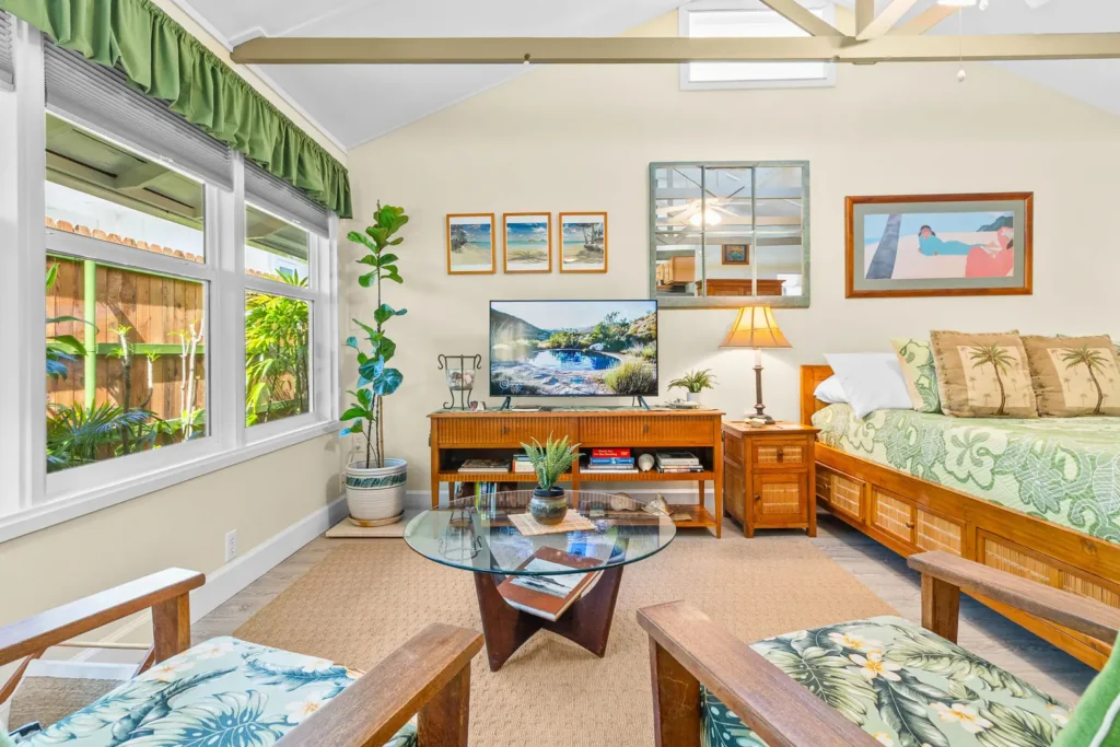 Rattan armchairs and glass coffee table in the Lanikai Garden Studio sitting area