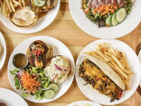 Spread of island plates at Uahi Island Grill in Kailua, Oʻahu